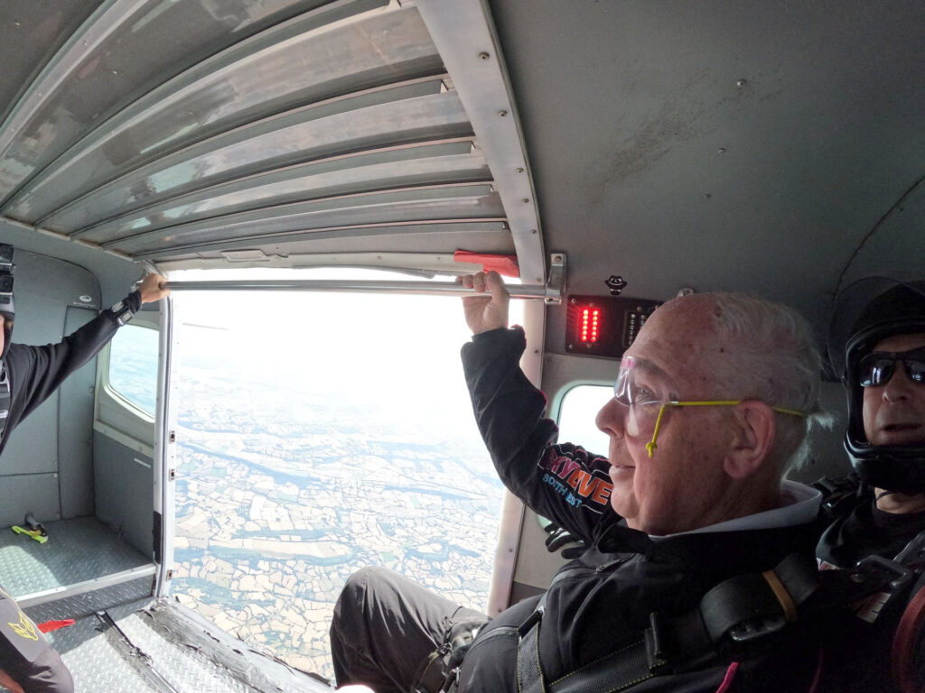 John Payne with his skydiving instructor inside the air plane about to jump.