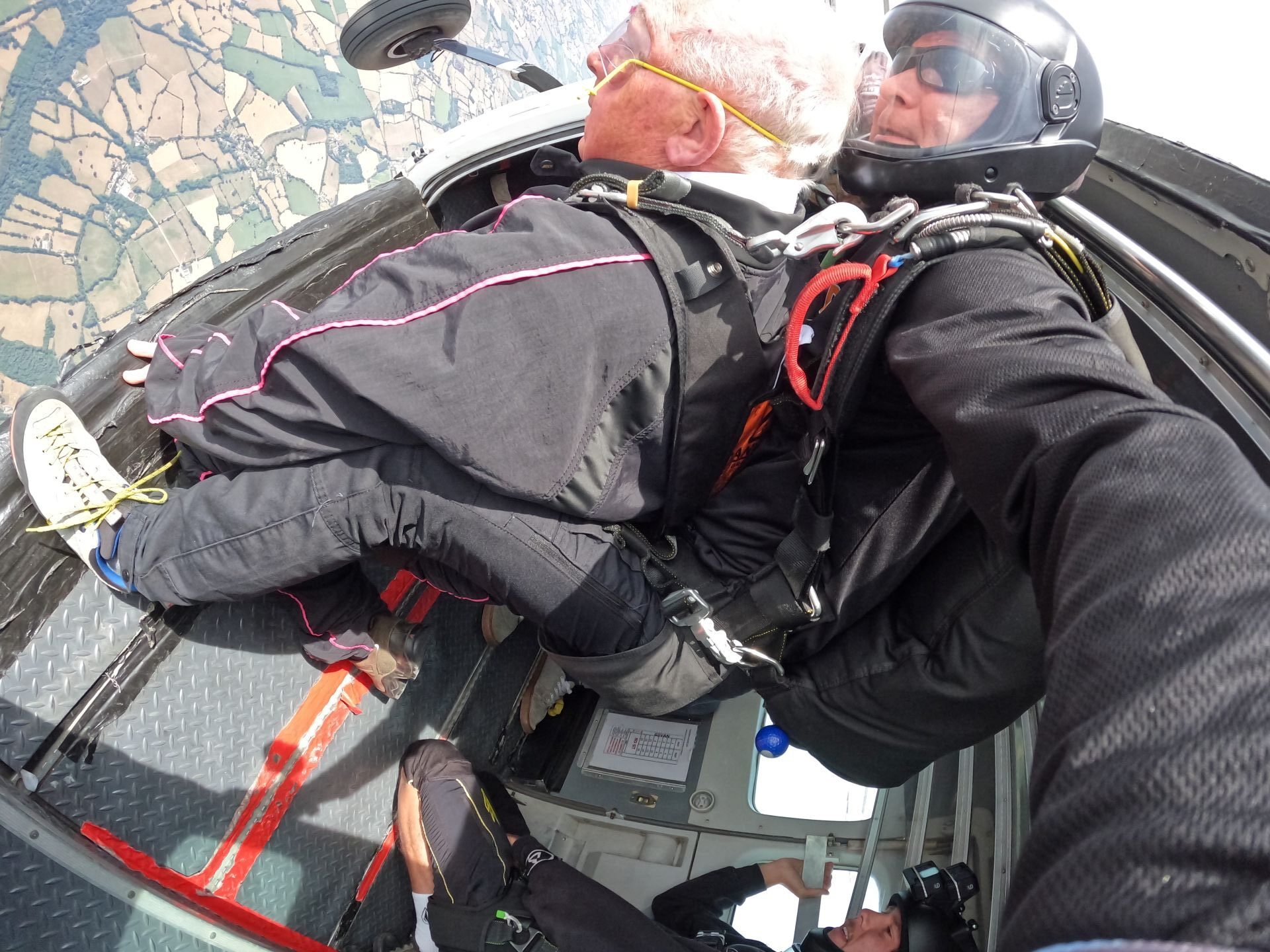 John Payne with his skydiving instructor as they are about to jump from the air plane.