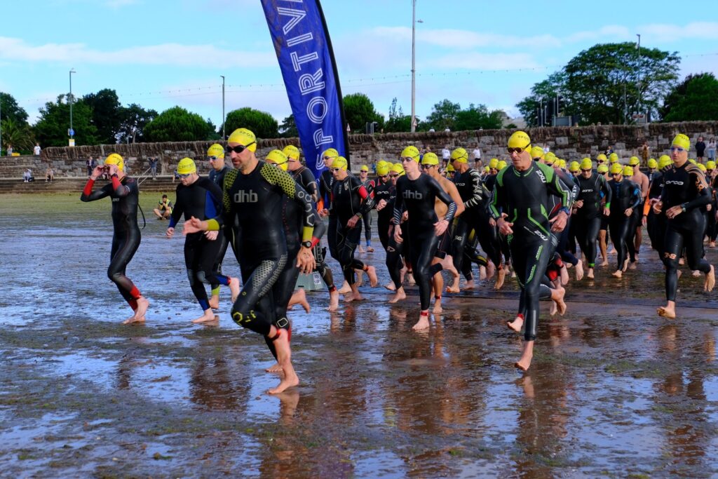 English Riviera participants running into the sea at Torre Abbey in Torquay