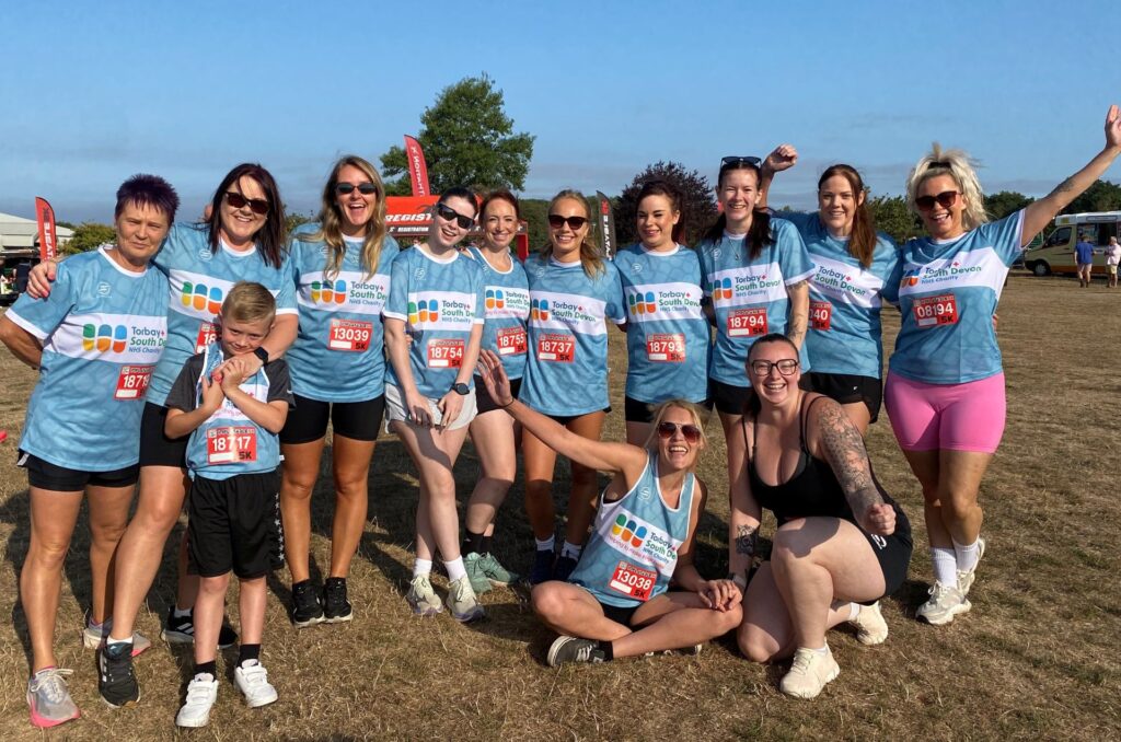 Group photo of the Tarr family and Emergency Department 5k team