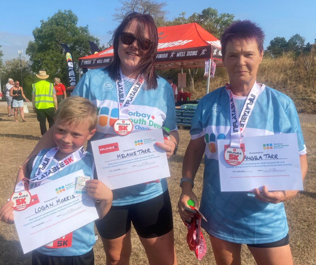 The Taff family with their finishers certificates