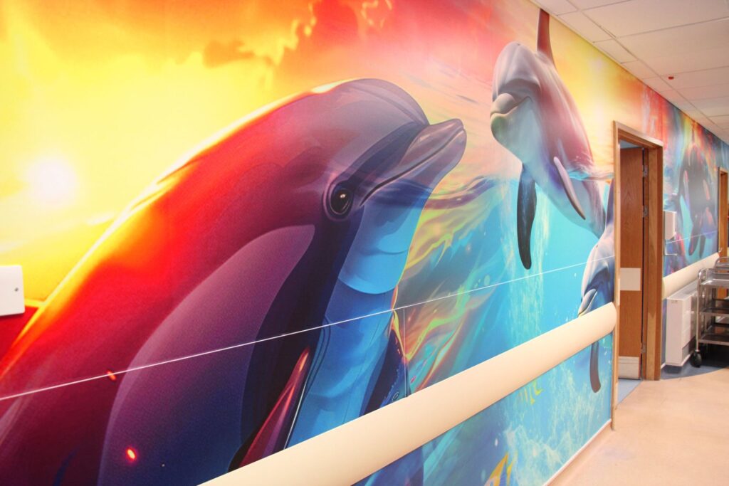 Vinyl wall covering featuring dolphins in Torbay Hospital's Louisa Cary Ward.